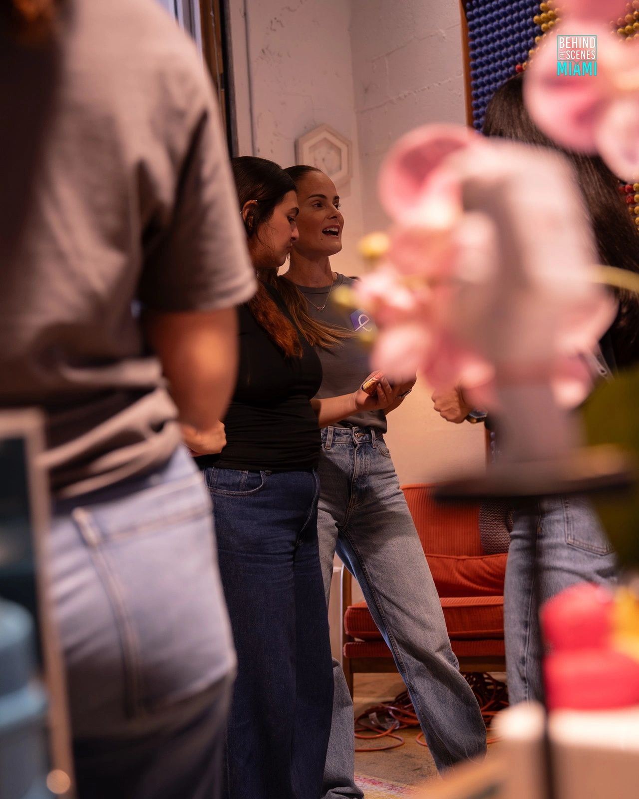 Two guests take in the talks at the Miami AI Summit hackathon.