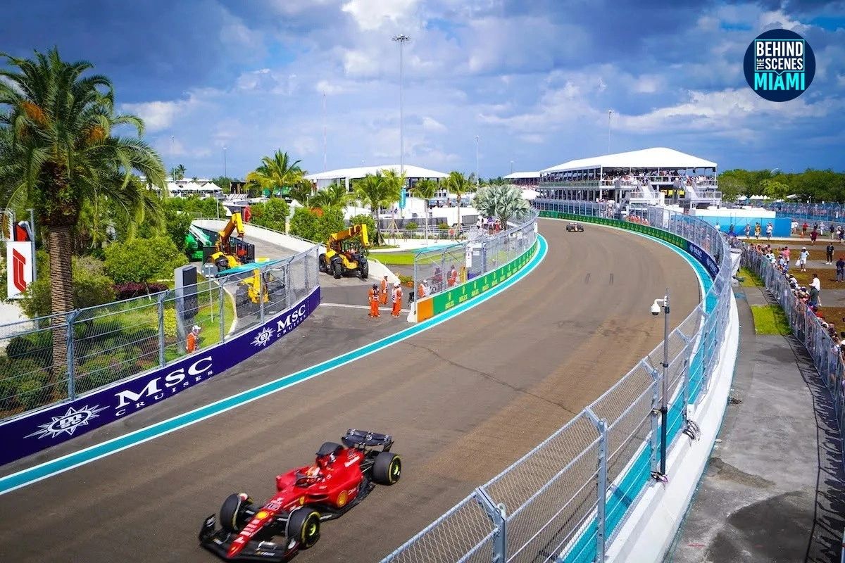 A Ferrari at full lean through the Miami International Autodrome.