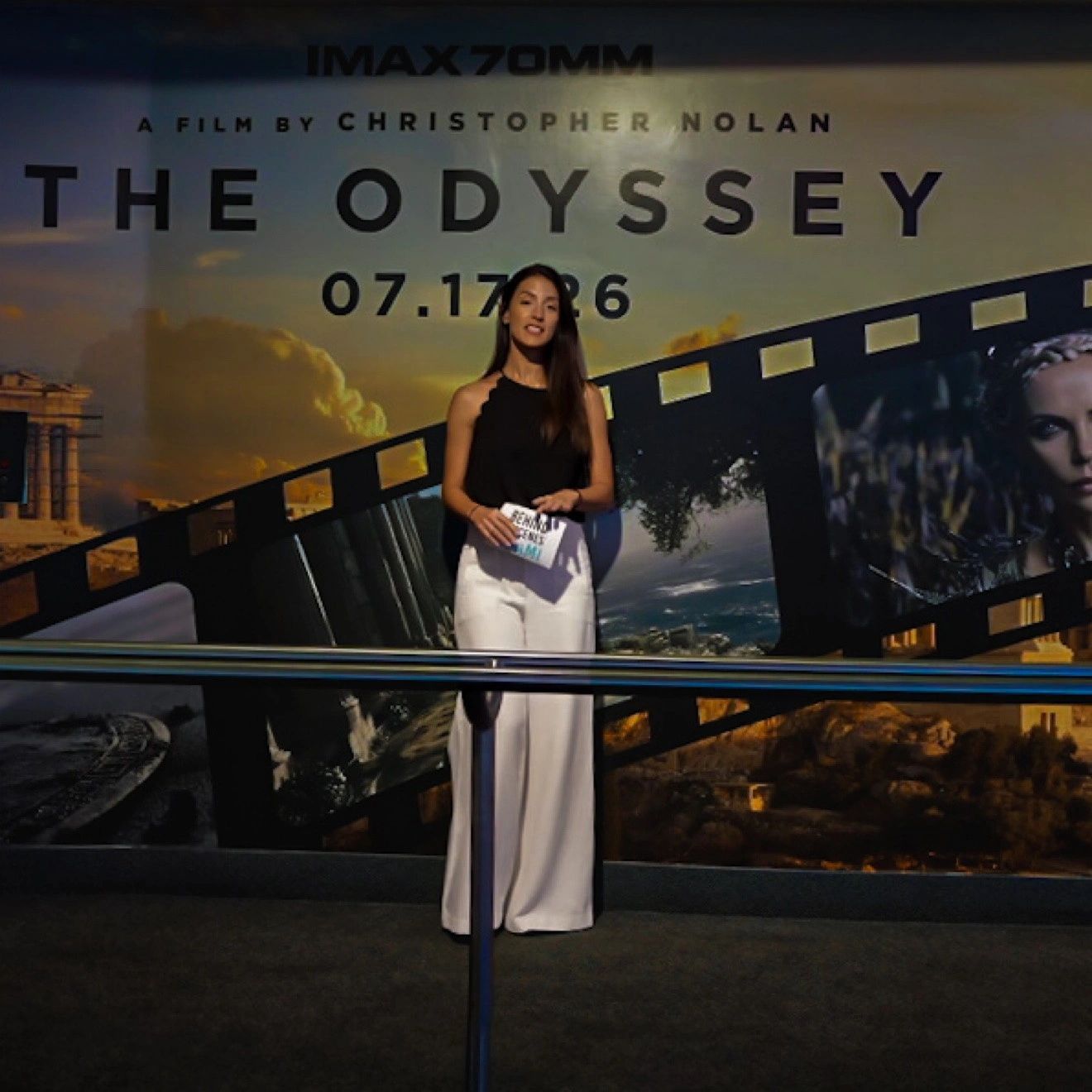 Yelain Santoyo in front of The Odyssey, Christopher Nolan's film in IMAX 70mm.